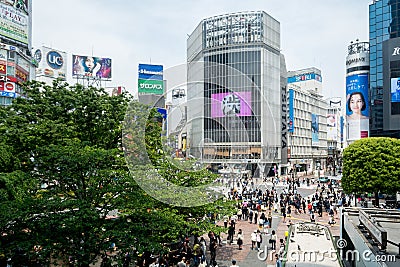 Shibuya, Tokyo, Japan - Shibuya scramble crossing. Famous iconic place. Crowded and full of advertising billboards Editorial Stock Photo