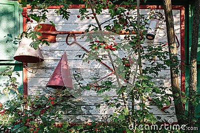 Shield with fire on the wall of a wooden building. Fire fighting tools, fire Stock Photo