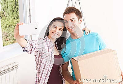 Shifting to a new life. Portrait of happy couple in new home. Stock Photo
