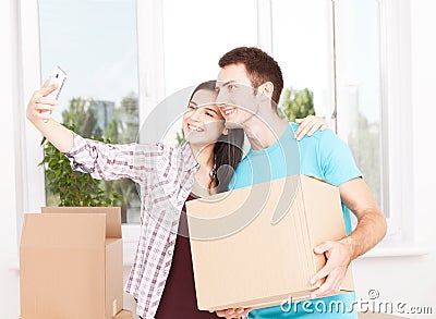 Shifting to a new life. Portrait of happy couple in new home. Stock Photo