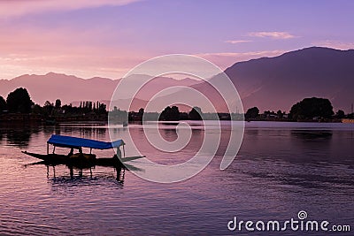 Shikara boats on Dal Lake with Sunset Dal Lake in Srinagar Jammu and Kashmir Stock Photo