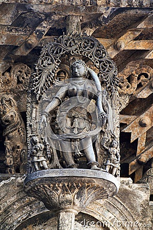 Shilabalika, celestial maiden, as a Dolu Kunita. A lady is palying a drum and dancing . Chennakeshava temple, Belur, Karnataka. No Stock Photo