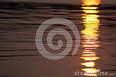 Shimmering sunset on Canobie Lake water. Stock Photo