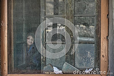 Shimshal high school children look through the wire mesh and pieces of cardboard Editorial Stock Photo