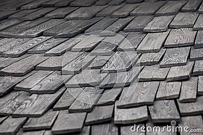 Shingle red cedar wooden shake wood siding row roof panel made of larch conifer tree. Stock Photo