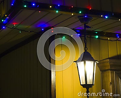 The shining lamp and garland on the house Stock Photo