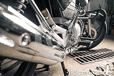 Shining motorcycle standing in garage Stock Photo