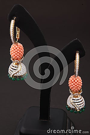 shining pearl studded traditional jhumka earrings for women Stock Photo