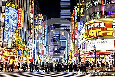 Shinjuku, Tokyo - Neon Signs Illuminate Busy Neighborhood at Night Editorial Stock Photo