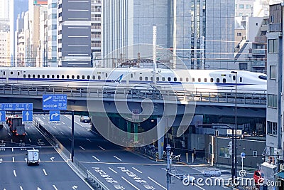 Shinkansen Bullet Train running on rail track at Tokyo, Japan Editorial Stock Photo