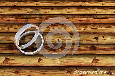 2 Shinny Silver Rings on bamboo plank. Stock Photo