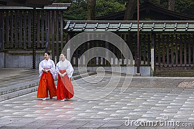 Two Mikos in Tokyo`s Meiji Shrine, Japan Editorial Stock Photo