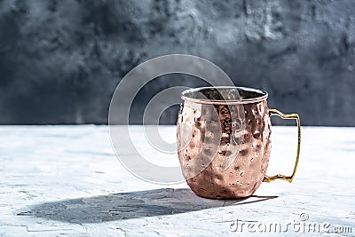 Shiny copper Moscow Mule mug with handle. Hammered Vintage Copper Mug Stock Photo