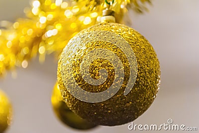 Shiny golden ball for Christmas tree decoration Stock Photo