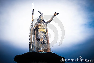 Shiny golden statue of Pachacuti on the pedestal in Cusco Stock Photo