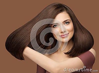 Shiny Hair Beauty Woman. Brunette Model Showing Glossy Silky Straight Hairstyle. Fashion Girl Portrait with Natural Make up Stock Photo