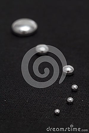 Shiny Mercury drops on a black background II Stock Photo
