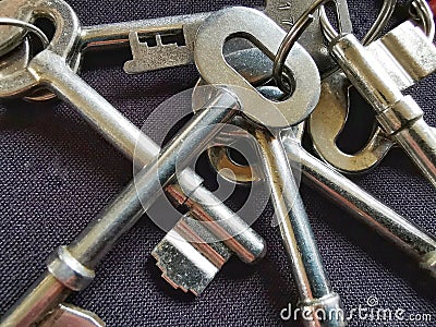 Shiny Metal house door keys on Black background Stock Photo