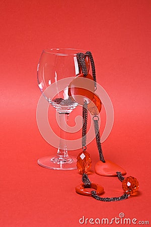 Shiny necklace in glass on a red Stock Photo