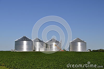 Shiny new steel grain bins Stock Photo
