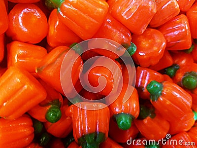 Shiny orange pumpkin candy for Halloween Stock Photo