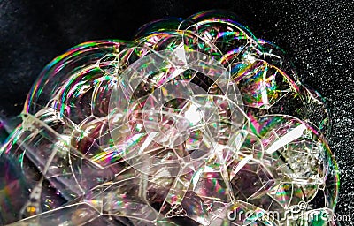 shiny rainbow bubbles on black background Stock Photo