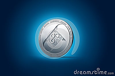 Shiny silver OMISEGO OMG coin displayed on gently lit dark blue background. Stock Photo