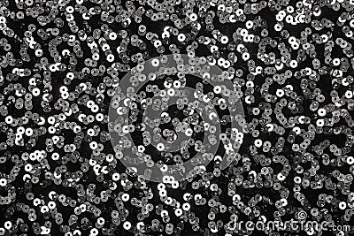 Shiny silver sequins on black background Stock Photo