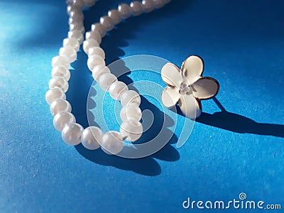 Shiny string of pearls and flower Stock Photo