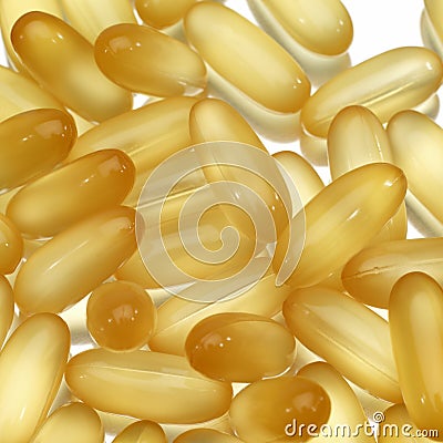Shiny yellow gel pills Stock Photo