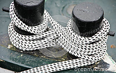 Ship bollard with sturdy ship rope Stock Photo