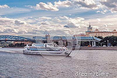 Ship of the Flotilla Radisson and Pushkin Andreevsky Bridge in Gorky Park. Editorial Stock Photo