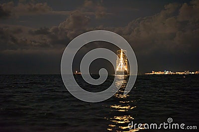 Ship glowing in the sea Stock Photo