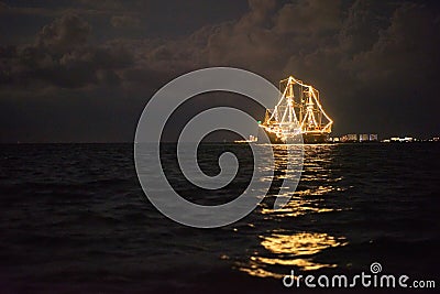 Ship glowing in the sea Stock Photo