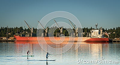 Ship and kayaks along Budd Bay, Puget Sound Editorial Stock Photo