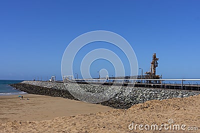 Ship loader and North Wall beach at Mackay Harbour Editorial Stock Photo