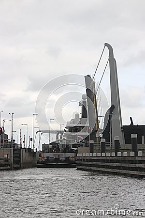 Ship Lonian is passing the julianasluis sluice with very small space Editorial Stock Photo
