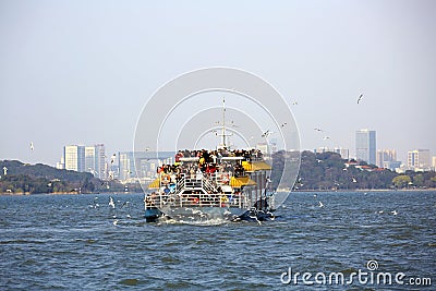 Ship with mass travelers on Taihu Lake, Wuxi, China Editorial Stock Photo