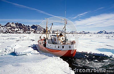 Ship in pack ice in Greenland Stock Photo