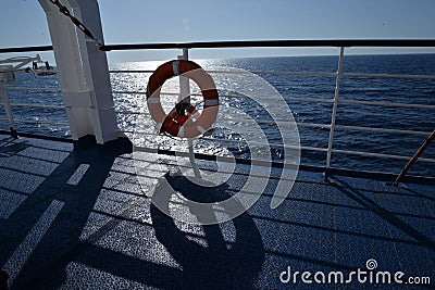 Ship railings and a lifebelt. The Adriatic sea seen from a ferry Stock Photo
