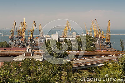 Ship-repair yard. Industrial zone of sea cargo port with grain dryers, containers, cranes and storehouses photo Stock Photo