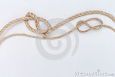 Ship ropes on white wooden background. Double stopper Stock Photo