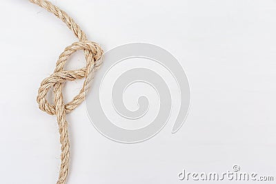 Ship ropes on white wooden background. Double stopper. Stock Photo