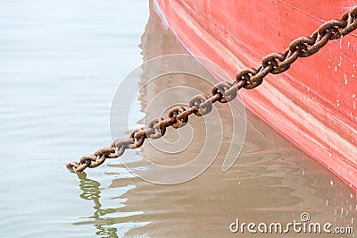 Ship`s hull painted with load chain line ,Red Ship Detail With big chain Stock Photo