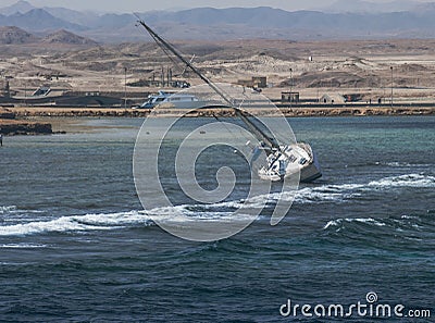 The ship tilted on the sea Stock Photo