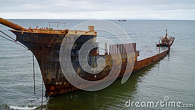 Ship wreck along the coast in Punta Arenas, Chile. Stock Photo