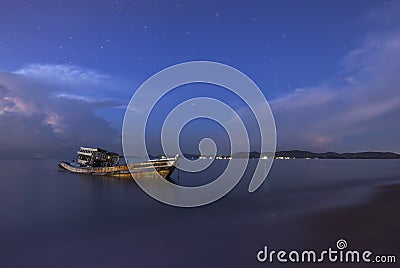 Ship Wreck fishing boat on the beach Stock Photo