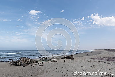 Ship wrecked on Skeleton coast in Namibia desert. Stock Photo