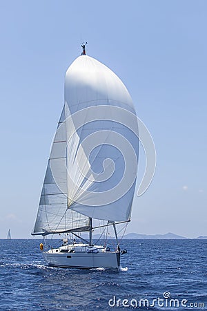 Ship yachts with white sails in the open Sea. Luxury Lifestyle. Stock Photo