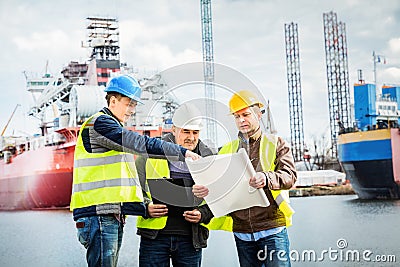 Shipbuilding engineers introducing new solution in a shipyard Stock Photo